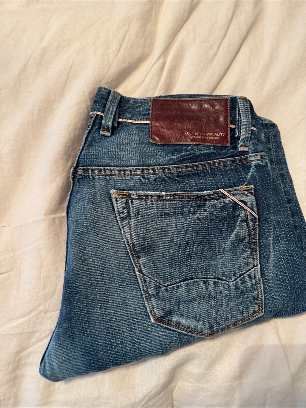 Cult of Individuality Men's Blue Denim Jeans with Brown Leather Patch